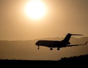 Aircraft flying below the sun